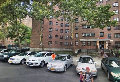 115-th-st-with-parked-cars-during-2018