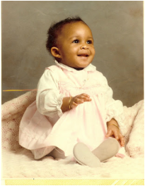 Danielle few months old sitting up in pretty white dress