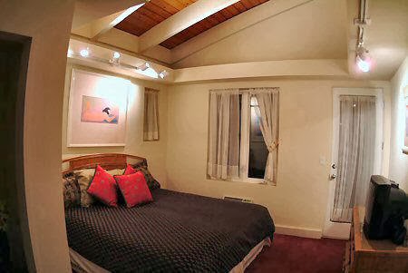 inside trailer bedroom with high ceiling