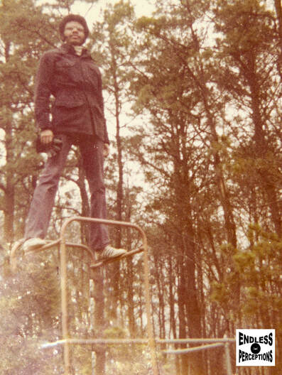 Lloyd standing on monkeybars