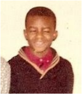 man-with-two-eyes-at-age-11-squinting-with-black-sweater
