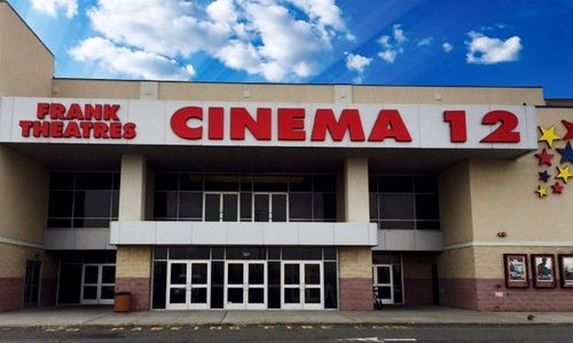 movie theater entrance against blue sky
