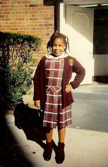pudgy girl in plaid dress