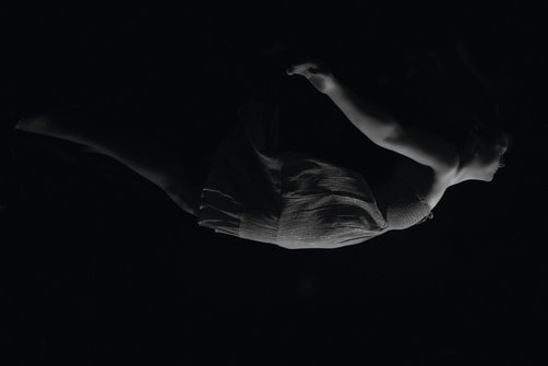The Mystery of Dreaming. Woman floating while asleep.